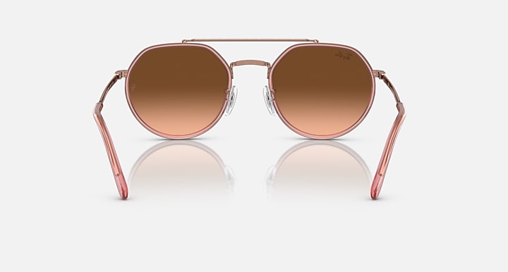 Round sunglasses front view with dark brown lenses and copper metal frame