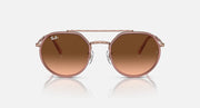 Round sunglasses front view with brown lenses and copper metal eyeglass frame