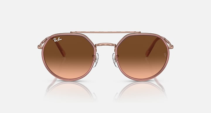 Round sunglasses front view with brown lenses and copper metal eyeglass frame