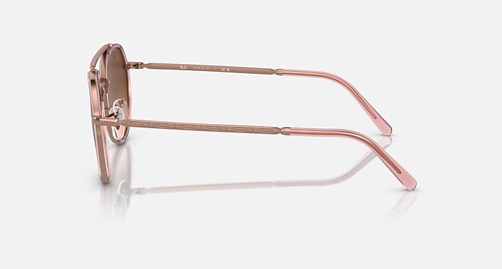 Round sunglasses side view with copper metal frame and thin temple arms