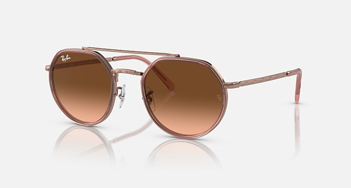 Round sunglasses with copper metal frame and brown gradient lenses