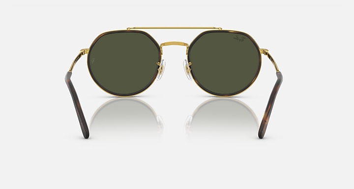 Round sunglasses front view with gold frame and dark green lenses