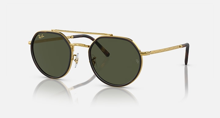 Round sunglasses with gold frame and dark green lenses