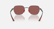 Sunglasses with dark gray frame and rose-brown lenses, red inner arms, oval profile.