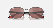 Sunglasses with dark frame and pink-brown gradient lenses, round-oval eye shape.