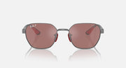 Sunglasses with dark gray frame and rose-tinted lenses, oval shape, metal bridge.