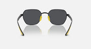 Black sunglasses with dark lenses and yellow inner frame accents, round shape