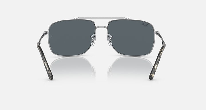 Square sunglasses with dark gray lenses, silver frame and straight bridge