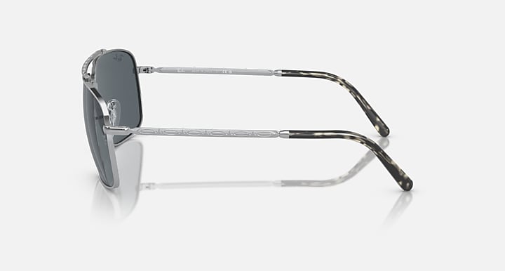 Square sunglasses side profile with dark gray lens and silver frame