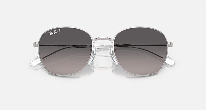 Ray-Ban RB3809 round sunglasses with clear silver frame and gray-to-brown gradient lenses