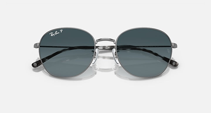Round sunglasses with silver-tone frame and dark gradient tinted lenses.