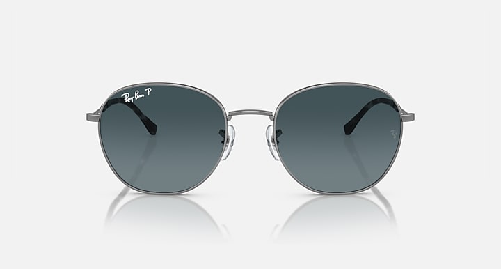 Round sunglasses with silver-tone metal frame and dark teal tinted lenses.