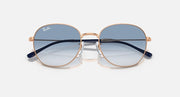 Round sunglasses with rose-gold frame and dark top-gradient blue tinted lenses.