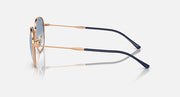 Sunglasses side view with rose-gold frame and dark navy patterned temples.