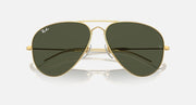 Aviator sunglasses with gold frame and olive green mirrored lenses, close front angle