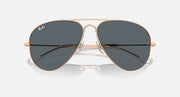 Aviator sunglasses with gold frame and dark gray mirrored lenses, close front angle
