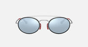Ray-Ban RB3847M round sunglasses front view with blue tinted lenses and red accents