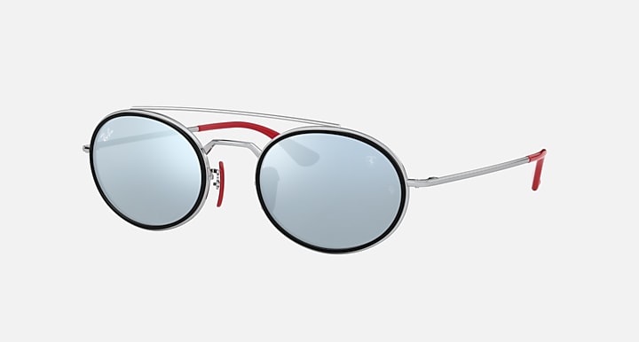 Ray-Ban RB3847M round sunglasses with blue tinted lenses and red-and-silver frame