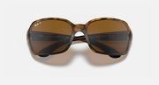 Front view of square sunglasses with dark brown gradient lenses and light frame