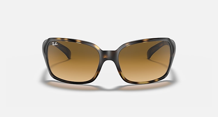Front close view of square sunglasses with brown lenses and light Havana clear frame