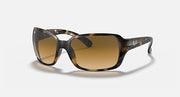 Angled view of square sunglasses with brown gradient lenses and Havana clear frame