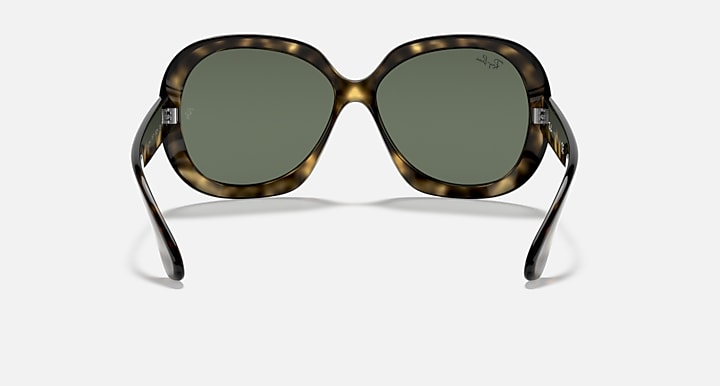 Front view wrap sunglasses with tortoiseshell frame and dark green lenses
