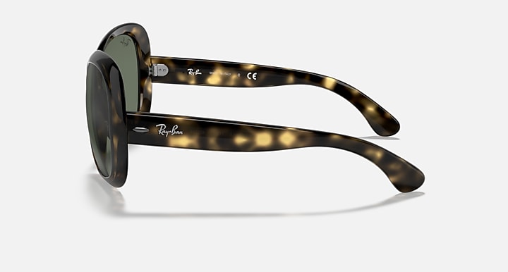 Side view wrap sunglasses with tortoiseshell frame and dark green lens