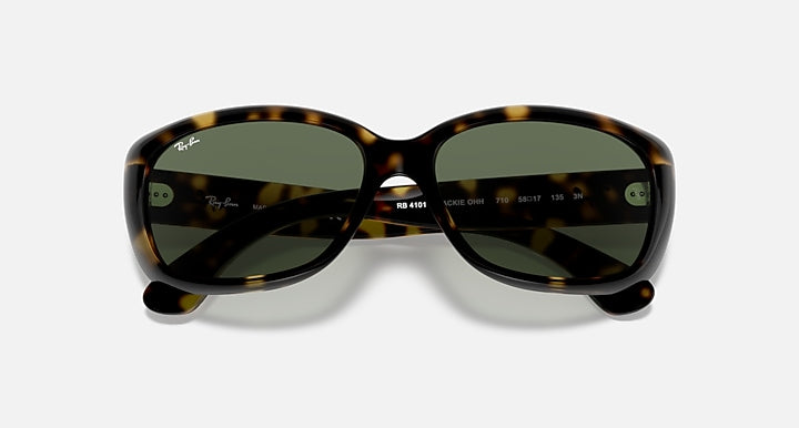 Tortoise-style sunglasses with dark green lenses and printed logo on temples