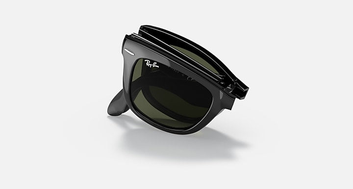 Folding Wayfarer sunglasses, matte black with dark green lenses, side folded