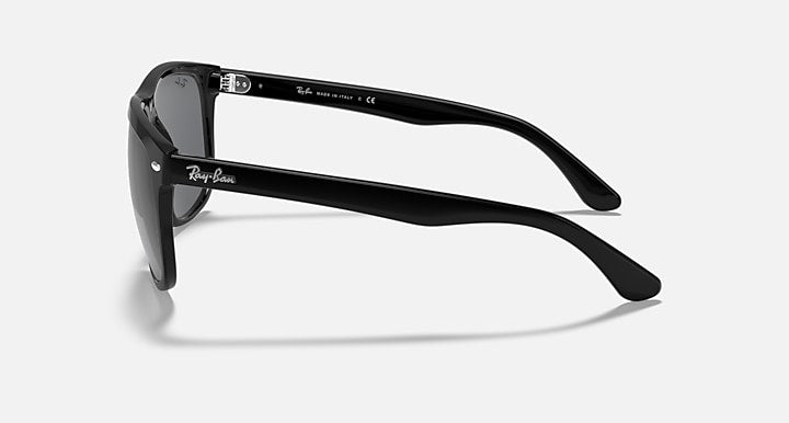 Ray-Ban sunglasses with glossy black frame and dark lenses, side view