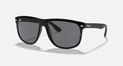 Ray-Ban sunglasses with matte black frame and dark lenses, side-front angle