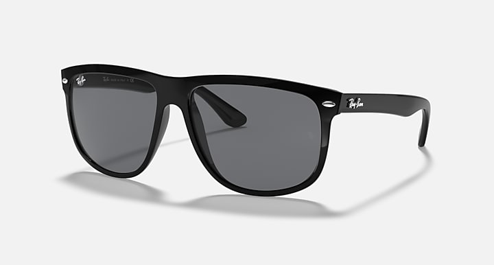 Ray-Ban sunglasses with matte black frame and dark lenses, side-front angle