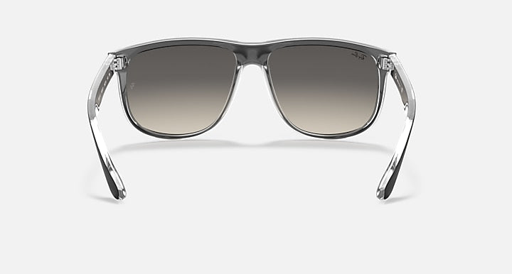 Ray-Ban sunglasses with translucent light grey frame and dark smoke lenses, front view