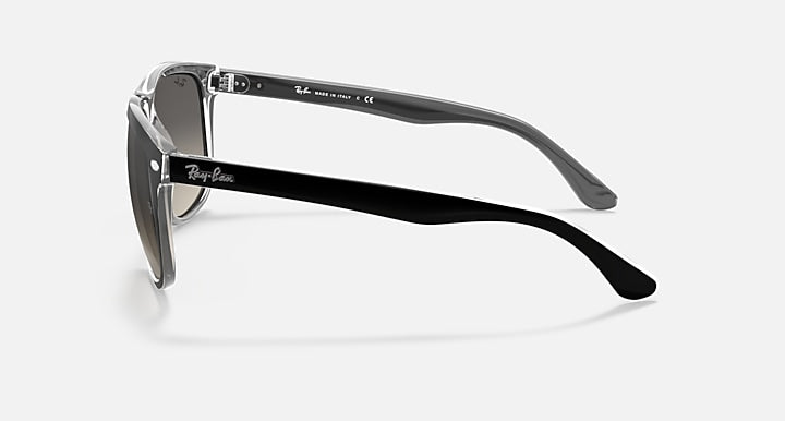 Ray-Ban sunglasses with black full-rim frame and dark lenses, side view
