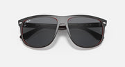 Sunglasses front view with black frame, dark lenses, and red trim around edges.