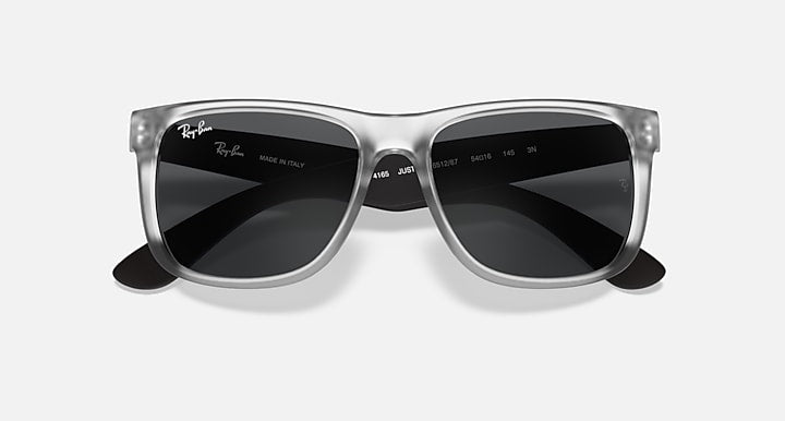 Ray-Ban Justin sunglasses with clear frame and dark gradient lenses, front view.