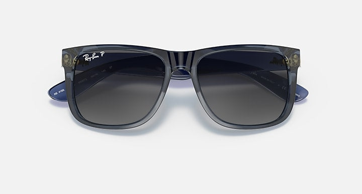 Navy blue sunglasses with dark lenses and oversized square frames