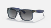 Blue sunglasses with dark lenses and thick front acetate frame