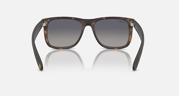Tortoiseshell sunglasses with dark lenses and full front wrap frame