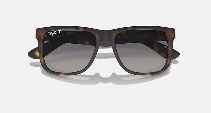 Tortoiseshell sunglasses with dark lenses and glossy gradient lens tint