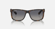 Brown tortoiseshell sunglasses with dark lenses and wide rectangular shape