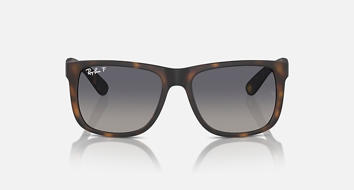 Brown tortoiseshell sunglasses with dark lenses and wide rectangular shape