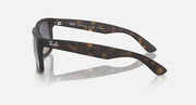 Tortoiseshell sunglasses with dark lenses and slim curved temple arms