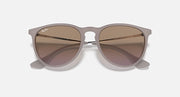 Sunglasses with light brown translucent frame and deep taupe gradient lenses