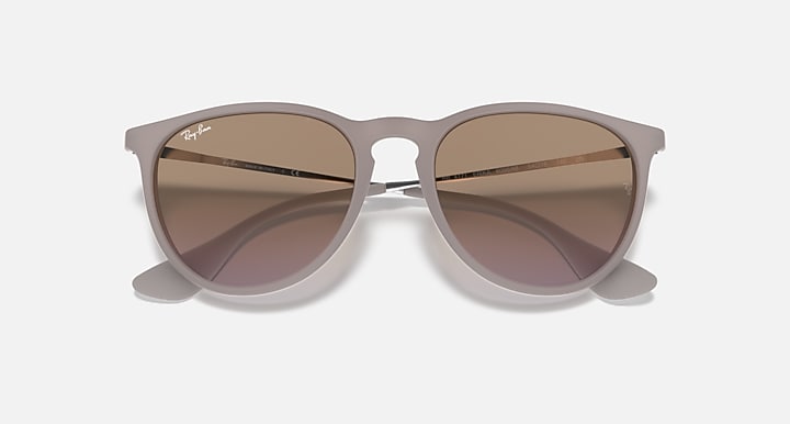 Sunglasses with light brown translucent frame and deep taupe gradient lenses
