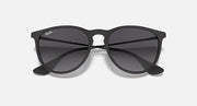 Cat-eye sunglasses with black frame and dark gray lenses, top-down view