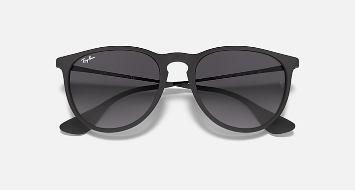 Cat-eye sunglasses with black frame and dark gray lenses, top-down view