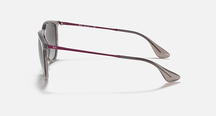 Sunglasses side view with clear dark frame and maroon-accented temples