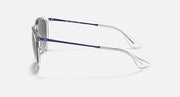 Sunglasses side view with clear silver frame and purple-blue temples
