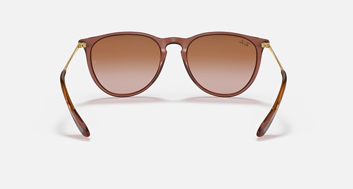 Brown sunglasses with gradient brown lenses and gold-tone metal accents